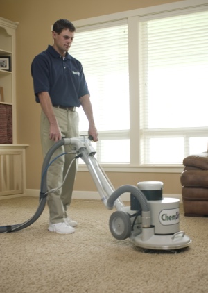 chem-dry technician cleaning carpets