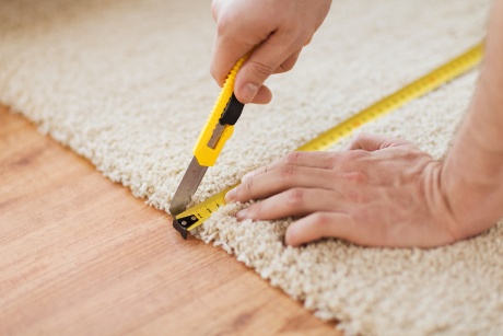 Picture of carpet measuring to repair and stretch carpet.