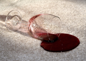 wine glass spill on carpet needs to be cleaned up using chem-dry's proprietary cleaning products