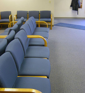 Office waiting area with cleaned carpet and cleaned upholstery.